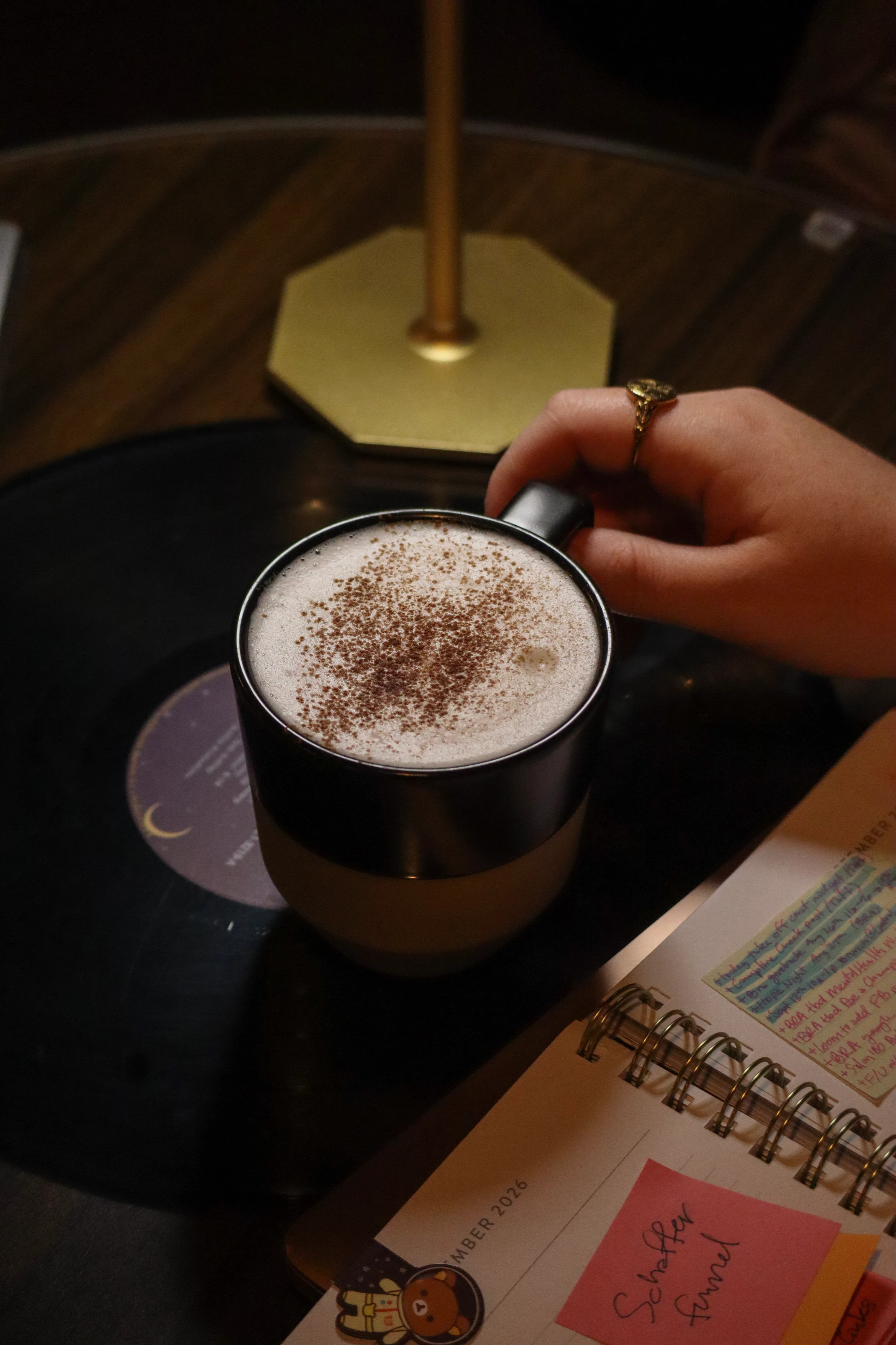 Chai latte on a vinyl record at Rhythm & Brew